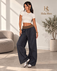 Pantalone Veldan in denim scuro con fascia in vita a costine marrone - foto indossata